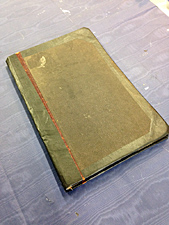 Masonic Lodge membership book with repaired spine