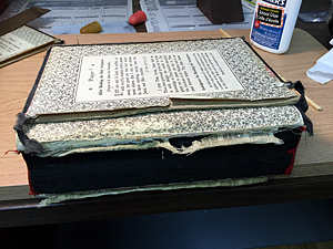 Prayer book with damaged spine and cover